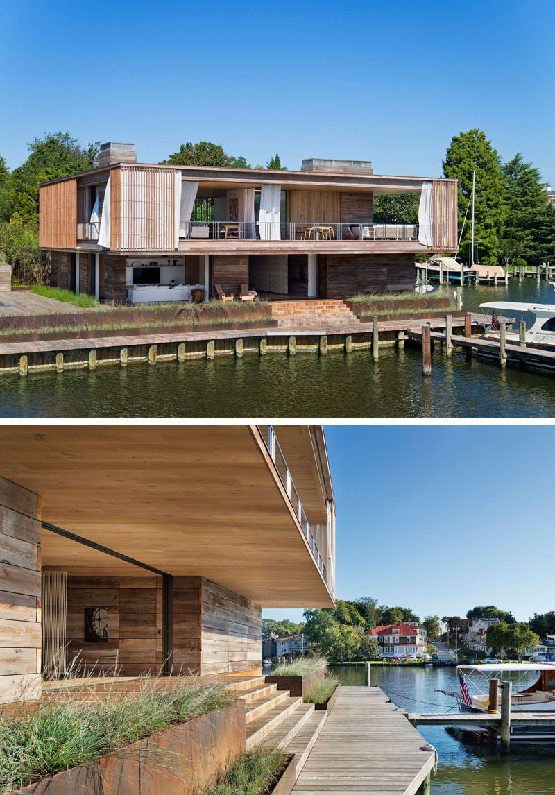 Deep overhangs protect this modern house and provide shade to the decks that surround it. The second floor, also encircled by cantilevered decks and balconies, is wrapped in layers of fixed Ipe screens and operable canvas drapes. #ModernHouse #WaterfrontHouse #ModernArchitecture