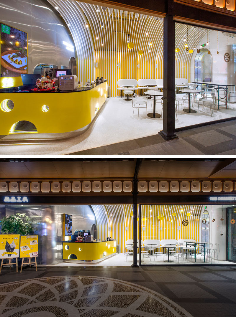 A bright yellow cheese-like bar complements the yellow walls and draws attention of people passing by. #CafeDesign #InteriorDesign #ModernCafe