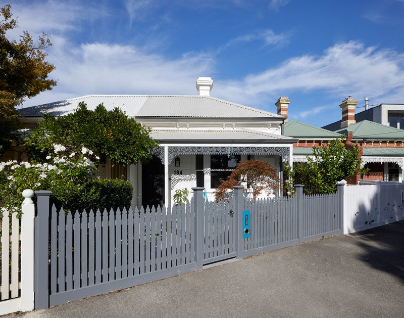 At the front of the house, the fence and ornate iron lacework have been painted to stand out among its neighbors. #CurbAppeal #PaintedFence #AustralianArchitecture