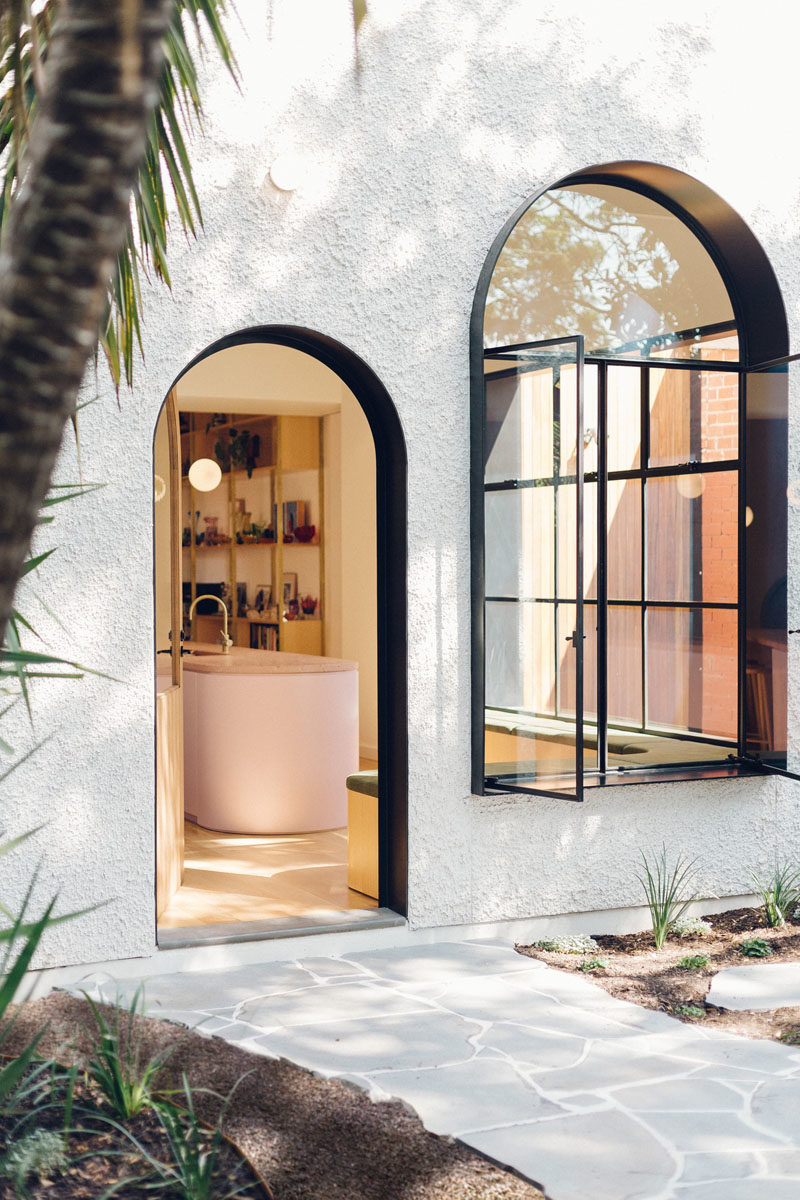 Window Ideas - This art-deco inspired house addition features black-lined deep window reveals, providing shade for the interior spaces, and adding a touch of drama to the white facade. #Windows #Doors #Architecture