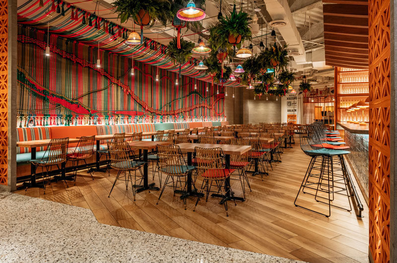 Restaurant Ideas - One of the main design elements in this new Miami restaurant, is a wall that's adorned with a multi-color handwoven macramé rope mural. #Mural #Art #RopeMural #Macrame #RestaurantIdeas