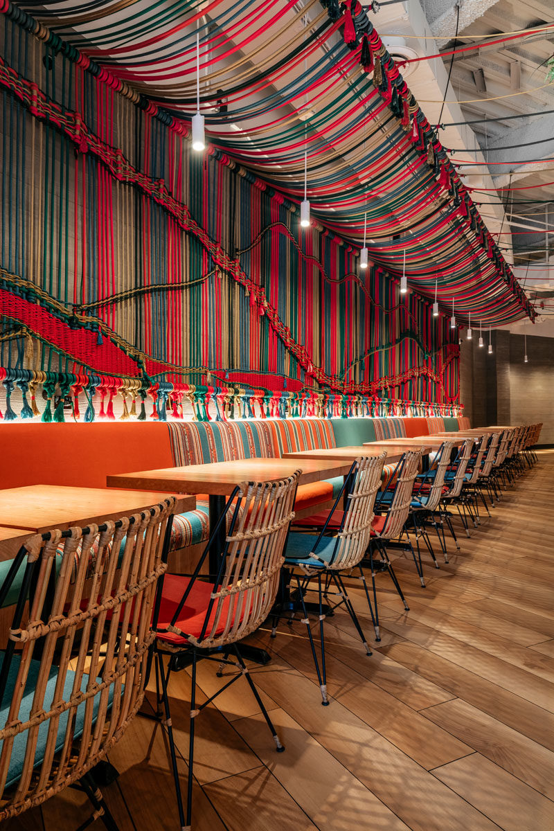 Restaurant Ideas - One of the main design elements in this new Miami restaurant, is a wall that's adorned with a multi-color handwoven macramé rope mural. #Mural #Art #RopeMural #Macrame #RestaurantIdeas