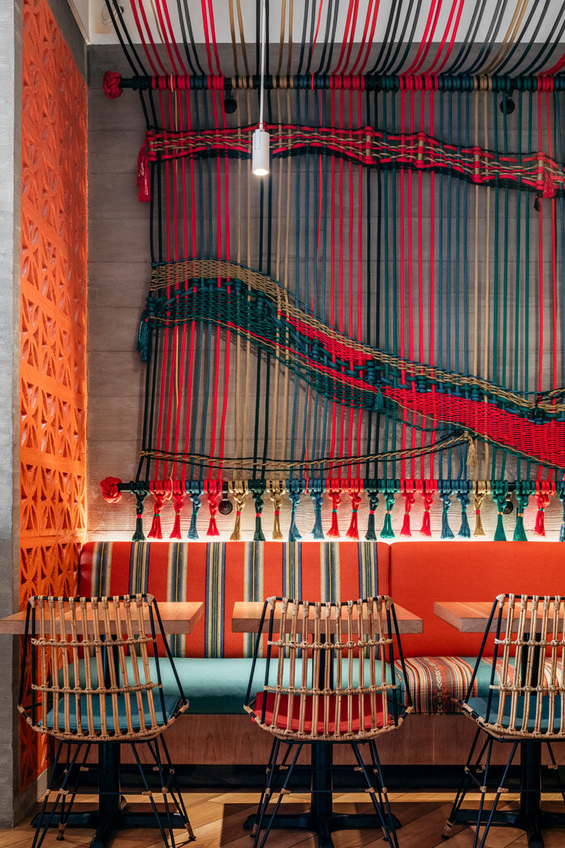 Restaurant Ideas - One of the main design elements in this new Miami restaurant, is a wall that's adorned with a multi-color handwoven macramé rope mural. #Mural #Art #RopeMural #Macrame #RestaurantIdeas