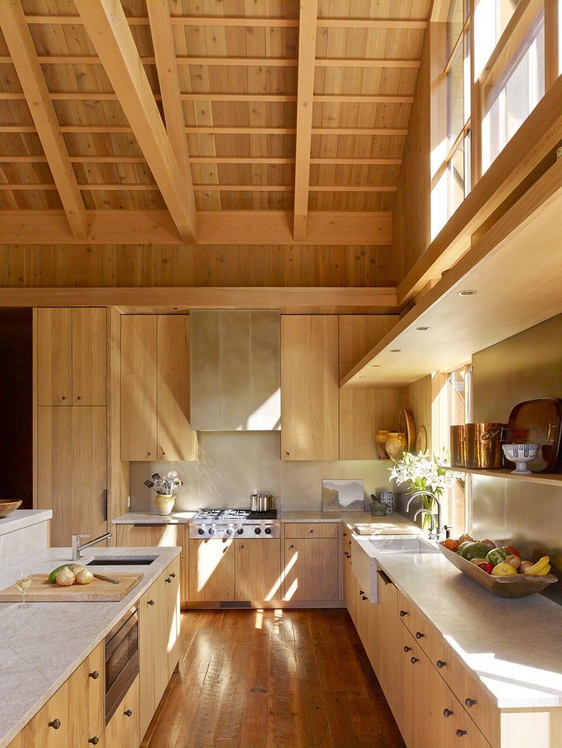 Kitchen Ideas - Cedar walls and reclaimed Baba fir floors  complement the owners’ mix of antique and contemporary furnishings, and give this kitchen a farmhouse modern appearance. #WoodKitchen #KitchenIdeas #FarmhouseModern