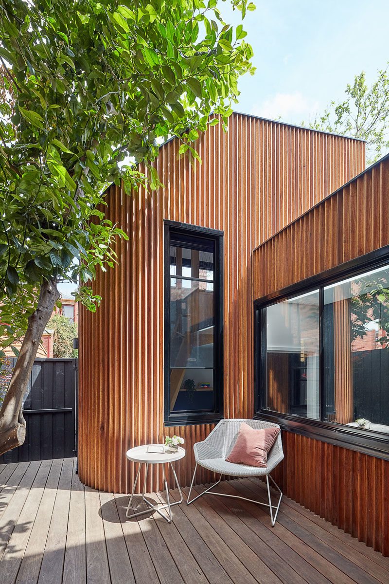 A wood covered house addition created space for a study area and kids play loft. #HouseAddition #WoodAddition