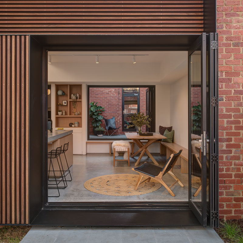 A folding glass door opens this living/dining area to a small patio and the backyard. #Doors #FoldingDoors