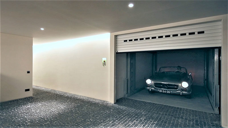 IdealPark has created a system that enables cars to be transported to different levels of the home, much like a lift, moving cars from street level to an underground garage. #CarPark #UndergroundGarage #GarageIdeas #Design #Architecture