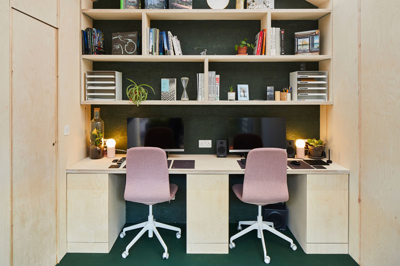 A small backyard office with room for two desks.