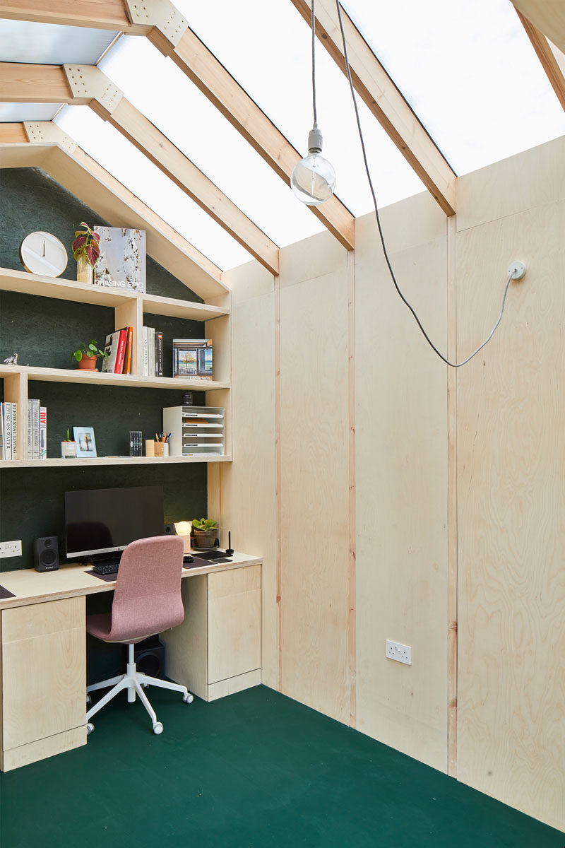 A small backyard office with a high ceiling.