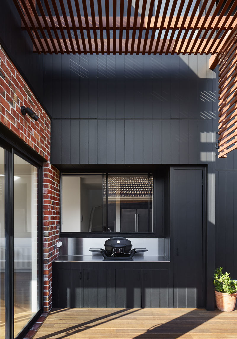 This small deck has a built-in outdoor kitchen with room for a tabletop bbq. #Deck #Pergola #OutdoorKitchen