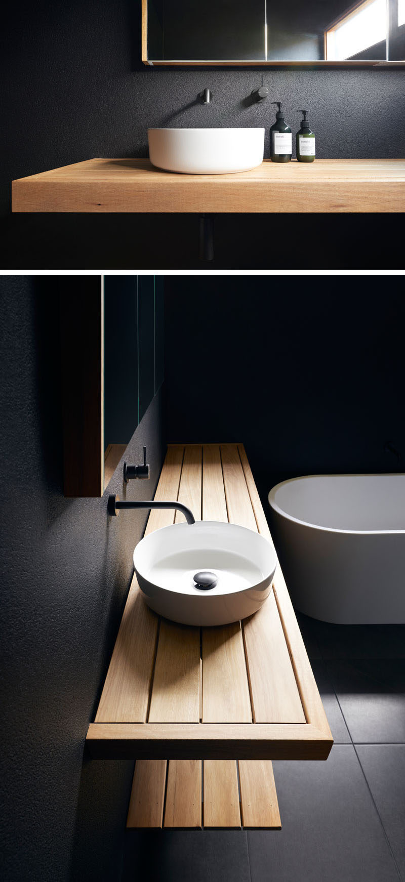 This modern bathroom has matte black walls, a wood vanity, and a white basin and bathtub. #BlackBathroom #ModernBathroom