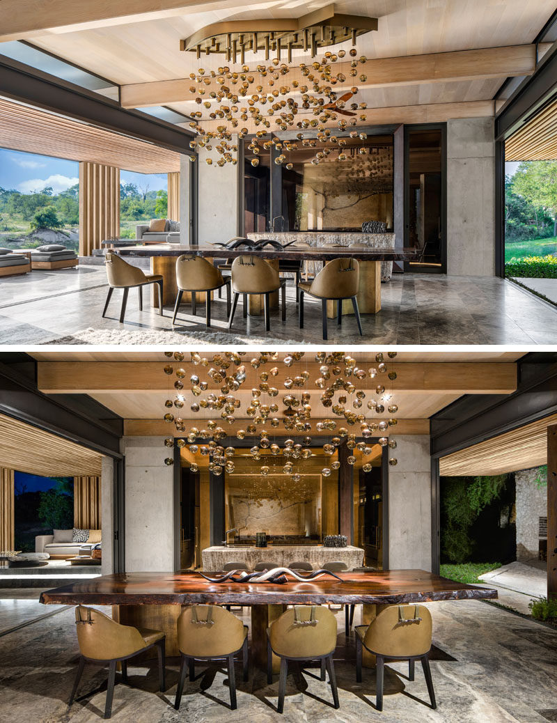 This large dining room has has sliding glass walls on both sides, that open to outdoor spaces, like a swimming pool and covered terrace. #DiningRoom #SlidingGlassWalls