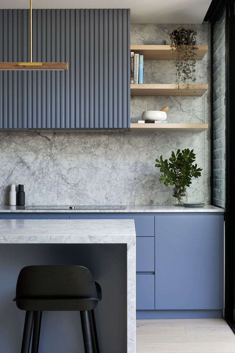 Kitchen Ideas - Blue-grey cabinets have been combined with marble, to create  a modern and eye-catching kitchen. #KitchenIdeas #BlueKitchen #GreyKitchen #KitchenDesign