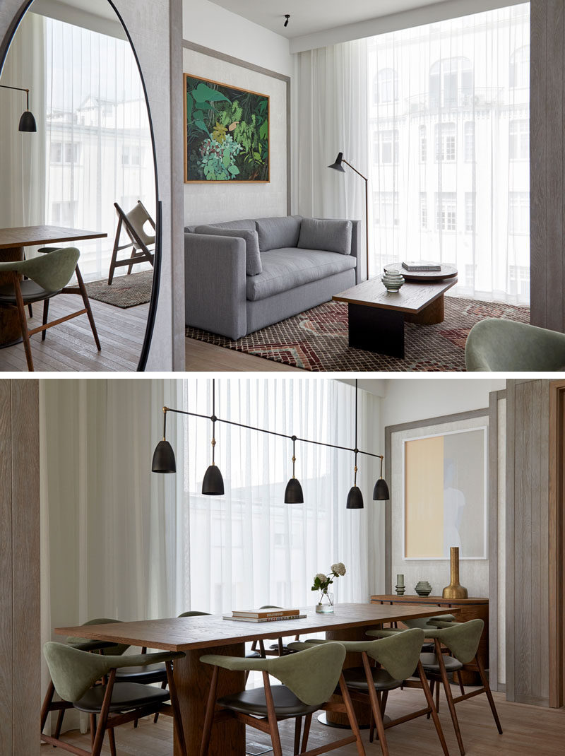 InteriorDesignIdeas - In this modern hotel suite, there's an open plan living room and dining area, both featuring artwork to make the room have a more home-like atmosphere. #LivingRoom #InteriorDesignIdeas #DiningRoomIdeas