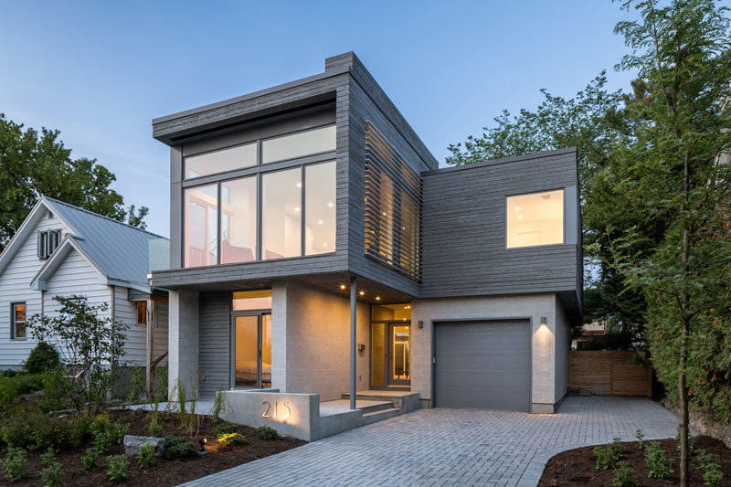 The exterior of this modern house showcases honed concrete-block walls and grey-stained cedar siding. #ModernHouse #ModernArchitecture #ConcreteBlockWalls #CedarSiding #GreyWood