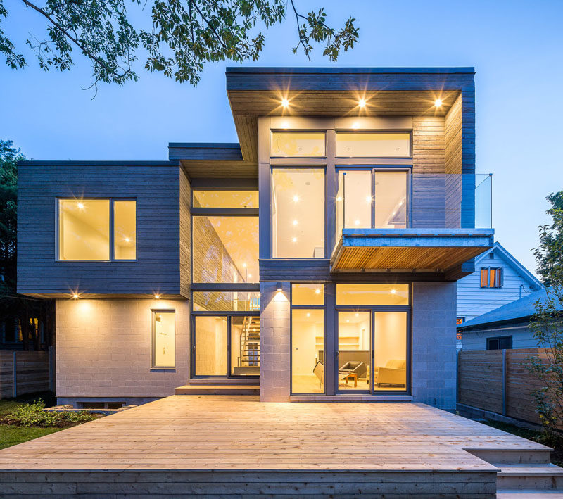 The exterior of this modern house showcases honed concrete-block walls and grey-stained cedar siding. #ModernHouse #ModernArchitecture #ConcreteBlockWalls #CedarSiding #GreyWood