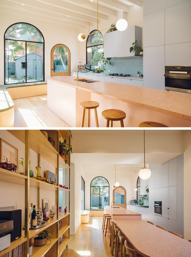 Kitchen Ideas - This modern pale blue kitchen features a large kitchen island that drops down into a dining area. #ModernKitchen #BlueKitchen #KitchenDesign