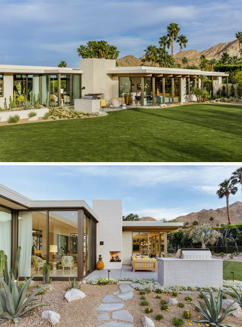 This modern outdoor living area incorporates a fireplace into the architecture of the house, while a built-in barbecue sits on the edge of the landscaped garden. #OutdoorSpace #OutdoorFireplace #OutdoorKitchen #BBQ #Landscaping