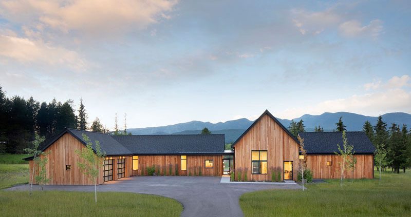 House Siding Ideas - Architecture firm CTA | Cushing Terrell, together with Tate Interiors, has recently completed a modern, rural house in Whitefish, Montana, that's nestled on 4.5 acres of land, features cedar siding, and is designed to take advantage of the surrounding views. #CedarSiding #ModernArchitecture #BlackRoof #WoodSiding