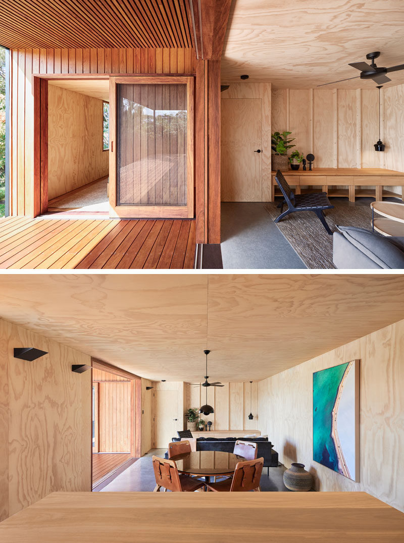 Lined in a warm timber cladding, the porch of this small modern house, provides a gentle contrast to the black exterior. Sliding glass doors connect the outdoor living spaces with the lighter plywood interior. #ModernPorch #ModernHouse #PlywoodInterior