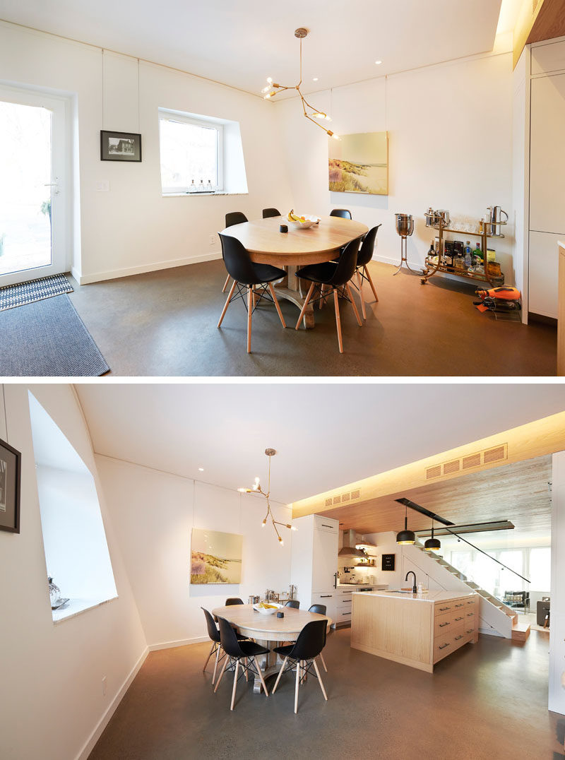 Dining Room Ideas - This open dining room has a minimalist chandelier hanging above the dining table, while a bar cart takes place in the corner. #DiningRoom #BarCart #DiningRoomIdeas