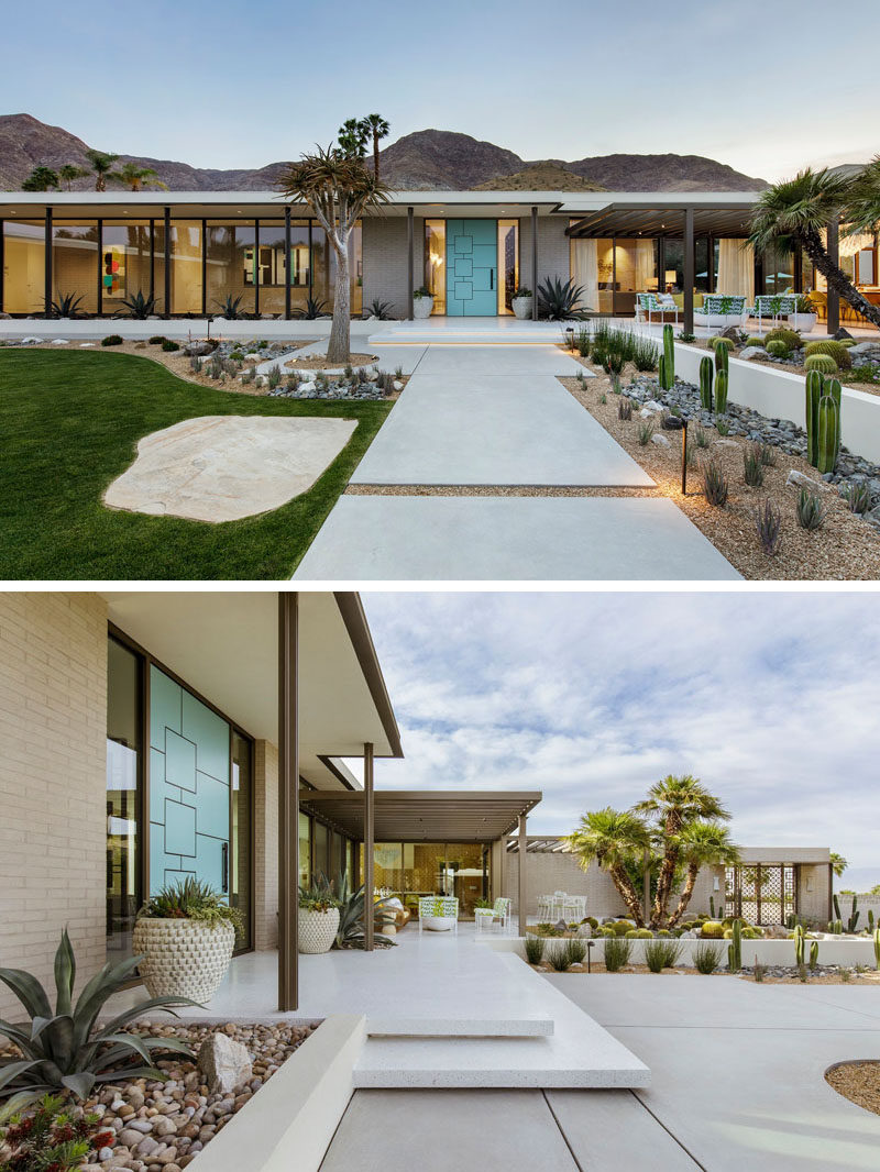The exterior of this renovated mid-century modern house features brick, stucco, painted steel, and glass, while the exterior walkways are made from poured concrete. #RenovatedHouse #LandscapeDesign #Landscaping