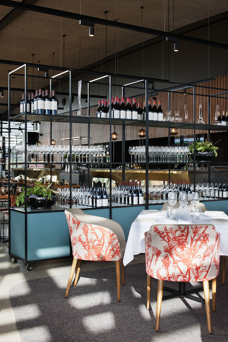 Shelving Ideas - In this modern restaurant, modular shelving on castor wheels enables the space to cater to larger functions. The shelving units also provide display space for merchandise and working zones for waiters. #ShelvingIdeas #RestaurantIdeas #ModularShelving #MoveableShelves #Shelving