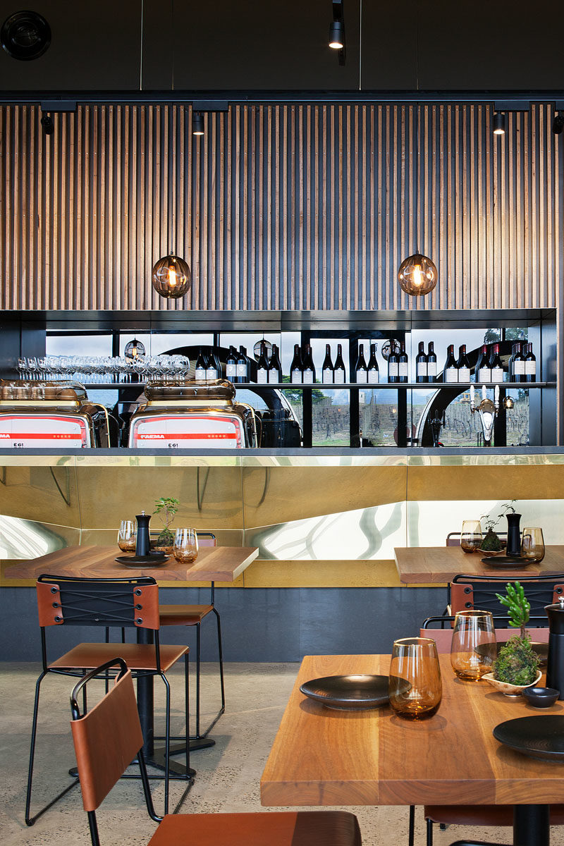 Bar Ideas - These modern winery tasting bars feature a repetitive tectonic form of shifting brass panels to reflect the undulating landscape. #BarIdeas #HospitalityDesign #RestaurantDesign