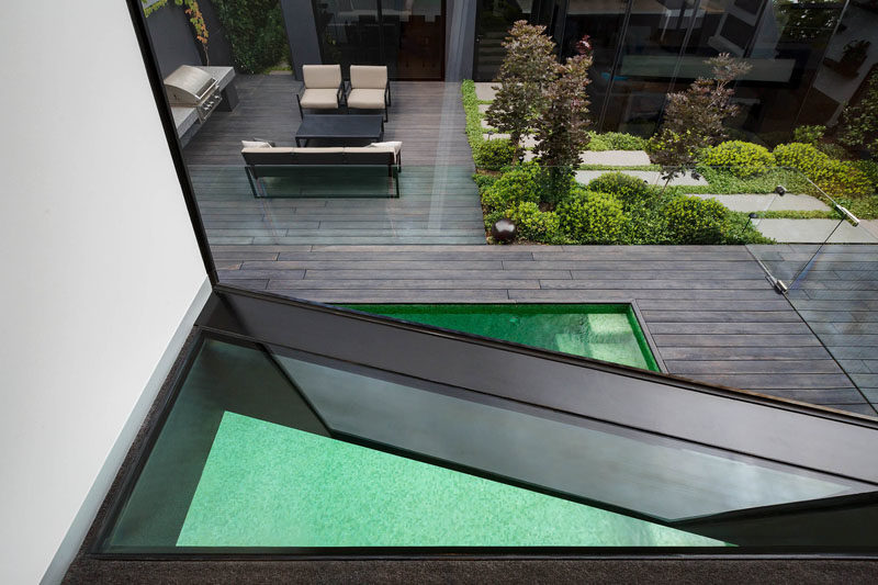 Window Ideas - This first-floor studio has a triangular floor window to provide additional views of the swimming pool. #TriangleWindow #WindowIdeas #FloorWindow