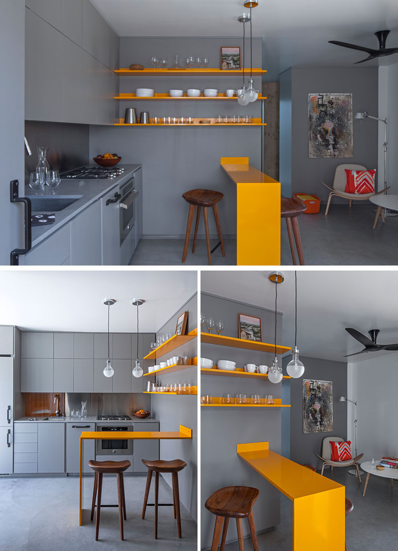 Kitchen Ideas - Stepping inside this modern micro apartment, and the kitchen cabinetry, countertops, and concrete floor exactly match in color, achieved with an integral additive color for the concrete. #GreyAndYellow #SmallKitchen #KitchenDesign #KitchenIdeas
