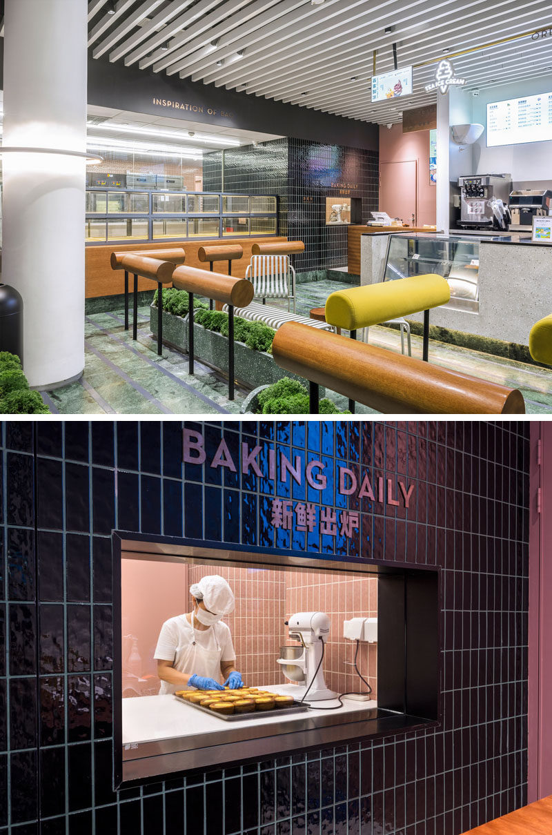 At one end of this modern bakery, there's a black tiled wall that surrounds a window, allowing you to have a glimpse of the bakers at work. #Bakery #BakeryDesign #ModernBaker #Window