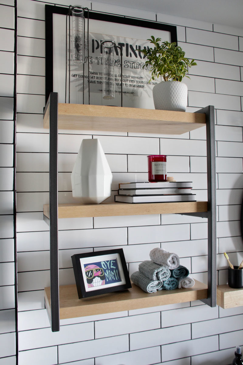 Shelving Ideas - This custom shelf in a renovated bathroom complements the rest of the apartment that has an modern industrial appearance. #ShelvingIdeas #ShelvingDesign #ModernShelf #BathroomShelf