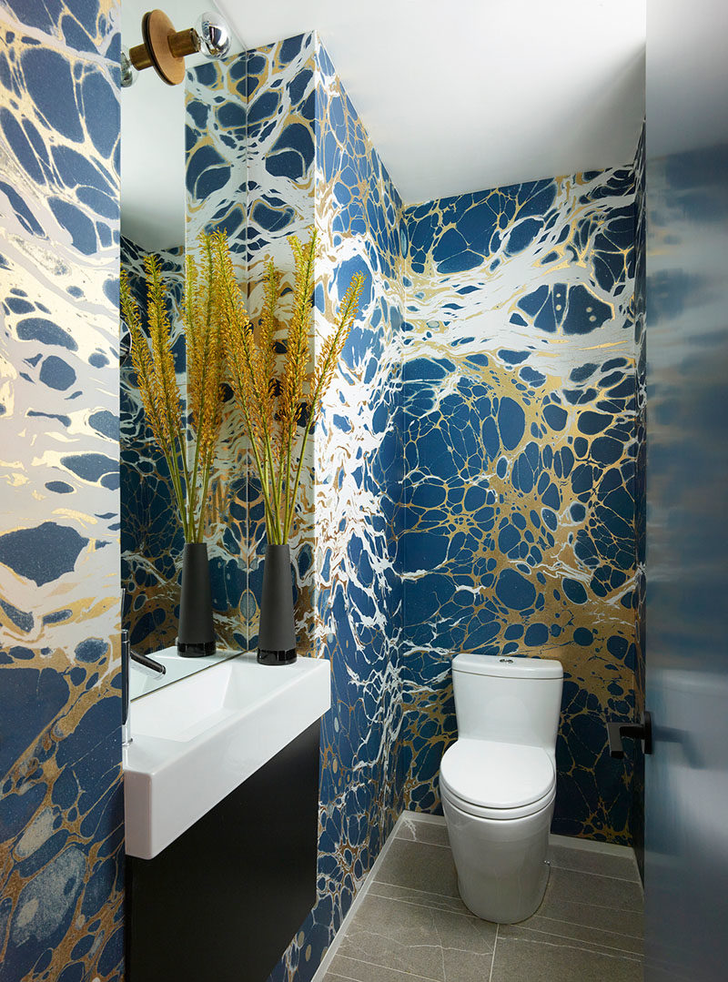 Bathroom Ideas - This modern bathroom features walls covered in 'Night' wallpaper by Calico. #BathroomIdeas #BathroomDesign #BlueBathroom