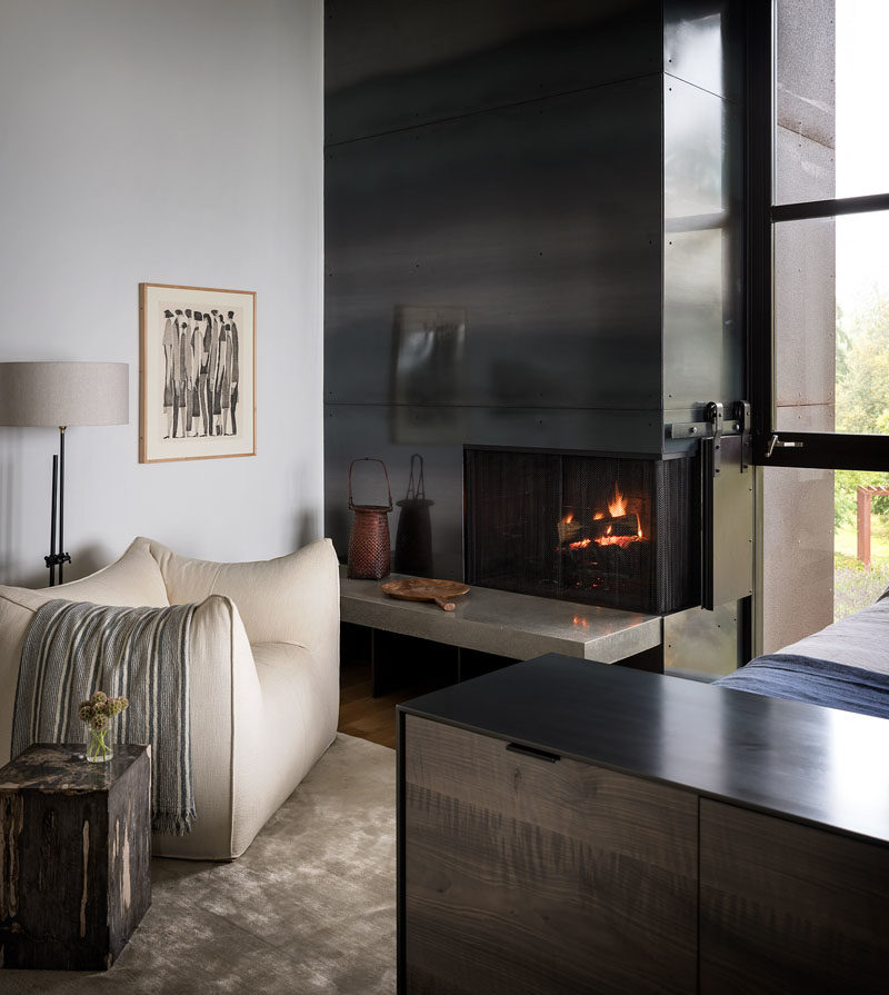 Bedroom Ideas - In this modern master bedroom, a custom leather and steel bed, designed by Geremia in collaboration with fabricator Tod Von Mertens, is complemented by a rolled steel and Thassos marble fireplace. #MasterBedroom #BedroomIdeas #Fireplace #SteelFireplace