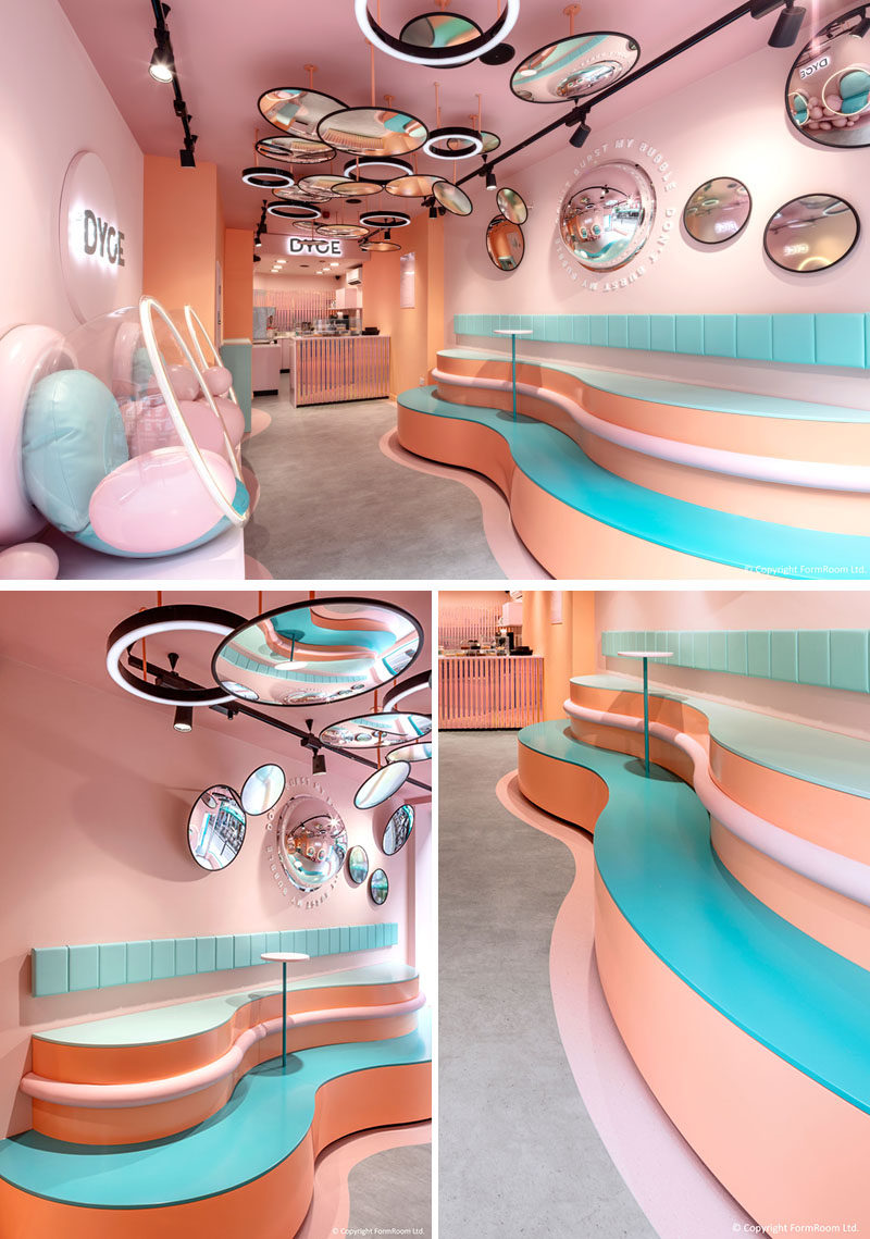 The interiors of this dessert bar have been inspired by Salvador Dali's surrealism, including soft pastel pink walls complemented by light blue and peach elements. Curvy tiered seating creates a casual seating experience and makes use of the interior height. #DessertBar #Cafe #InteriorDesign #Seating