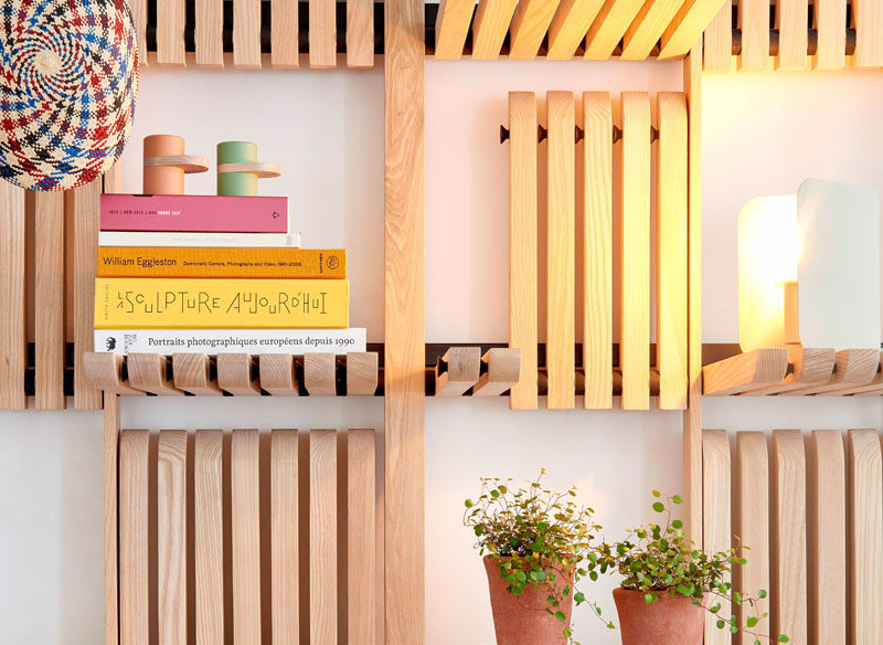 Shelving Ideas - These modern wood wall shelves are made of solid ash blades and can be operated with a single touch, with a system of magnets allowing them to stay in a vertical position. #ShelvingIdeas #WallShelf #FurnitureDesign #Design#Shelf