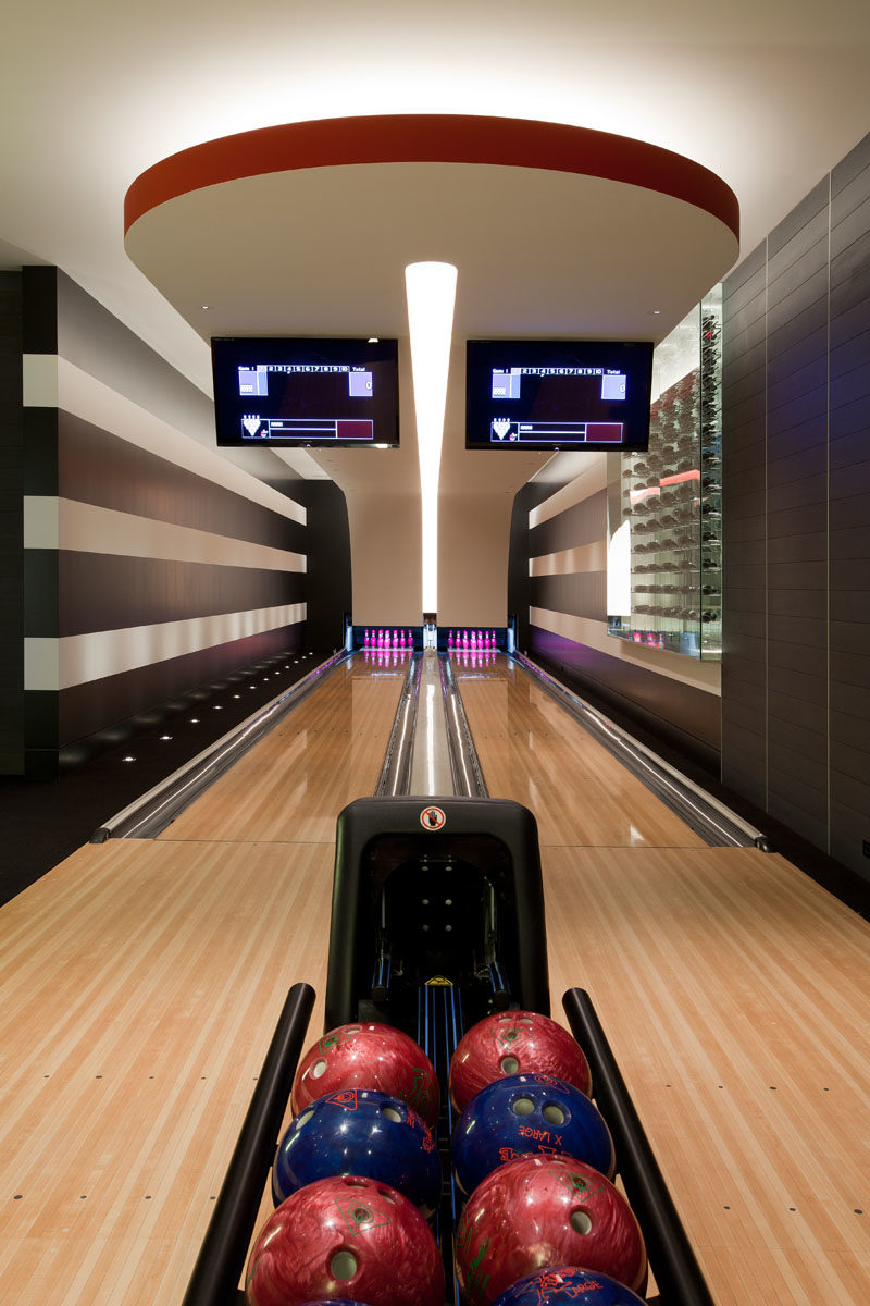 In the basement of this modern house is a two-person bowling alley. #BowlingAlley #Basement