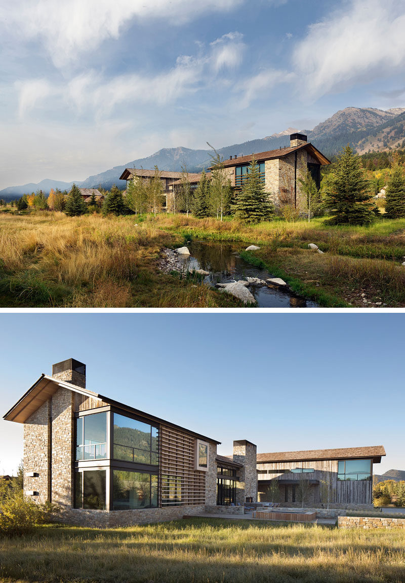 The modern house has a cedar shingle, gabled roof with eaves that extend to protect the reclaimed barn wood siding from the elements. A ribbon of rustic local fieldstone runs the perimeter of the project’s base and also clads the chimneys and feature walls. #ModernHouse #HouseDesign #ModernArchitecture
