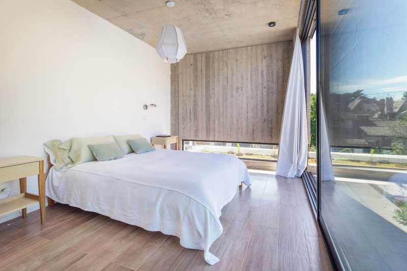 Bedroom Ideas- This modern master bedroom is filled with natural light from the large sliding glass door that opens to the rooftop. #MasterBedroom #BedroomDesign #BedroomIdeas