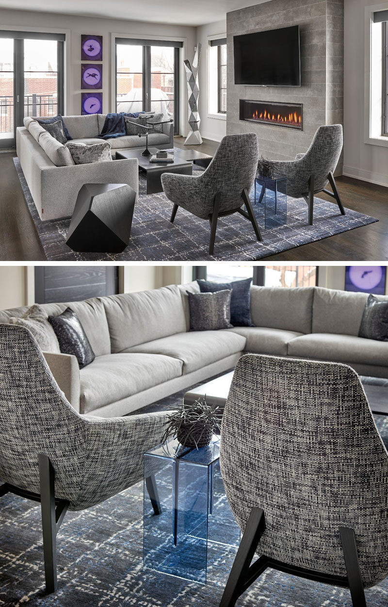 Living Room Ideas - In this modern living room, a comfortable sectional couch is focused on the fireplace, and anchored in the room by a large grey and white rug. #LivingRoom #ModernLivingRoom #Fireplace