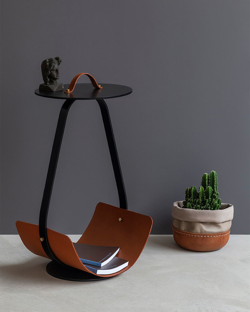 This modern side table has a leather handle that allows the user to move it around easily, so it can be placed wherever and whenever it's needed, while the steel frame provides strength and support. #ModernFurniture #ModernSideTable #ModernDesign