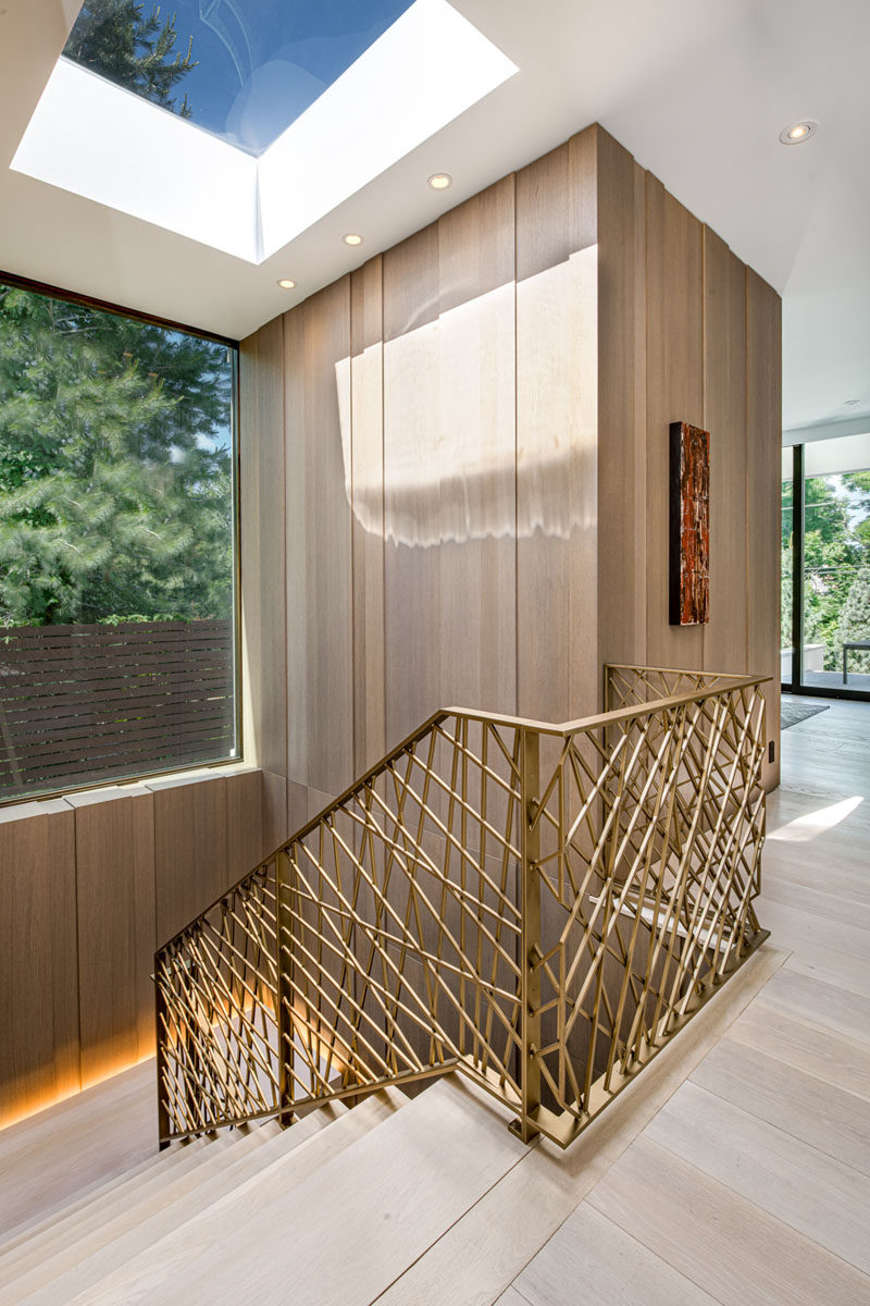 A large skylight and window help to keep this modern stairwell bright. #Stairwell #Staircase #DecorativeHandrails #Windows #Skylight