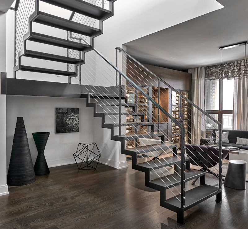 Stair Ideas - This industrial modern blackened steel staircase leads to the roof deck of this modern penthouse apartment. #SteelStairs #StairIdeas