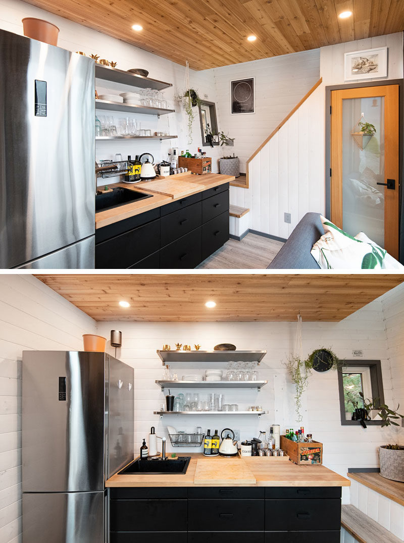 Tiny House Ideas - Inside this tiny house (cabin), white walls help to keep the lower floor bright, while the living room and kitchen share the space, and a bathroom is located under the stairs. #TinyHouseIdeas #TinyCabin #TinyHouse #KitchenDesign