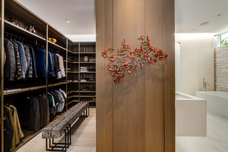 Closet Ideas - Between the master bedroom and the bathroom is a custom designed walk-in closet with plenty of storage. #WalkInCloset #ClosetIdeas #WalkInWardrobe