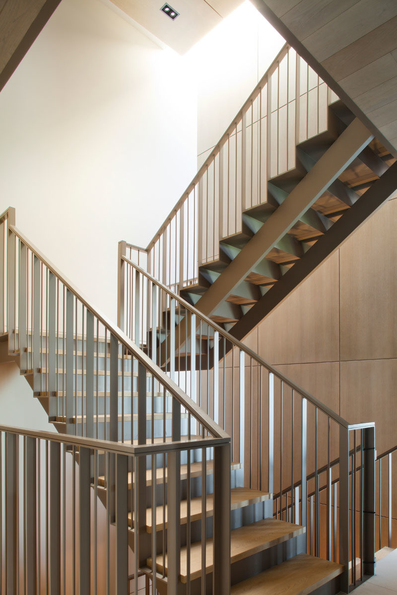 Stair Ideas - This wood and steel staircase is lit by natural light from from the nearby windows and skylights. #Stairs #ModernStairs #StairIdeas