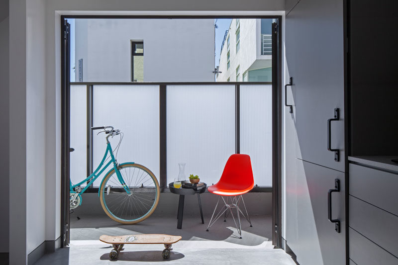 Double doors adjacent to the kitchen provide access to a patio that increases the amount of daylight filtering through into the apartment. #Patio