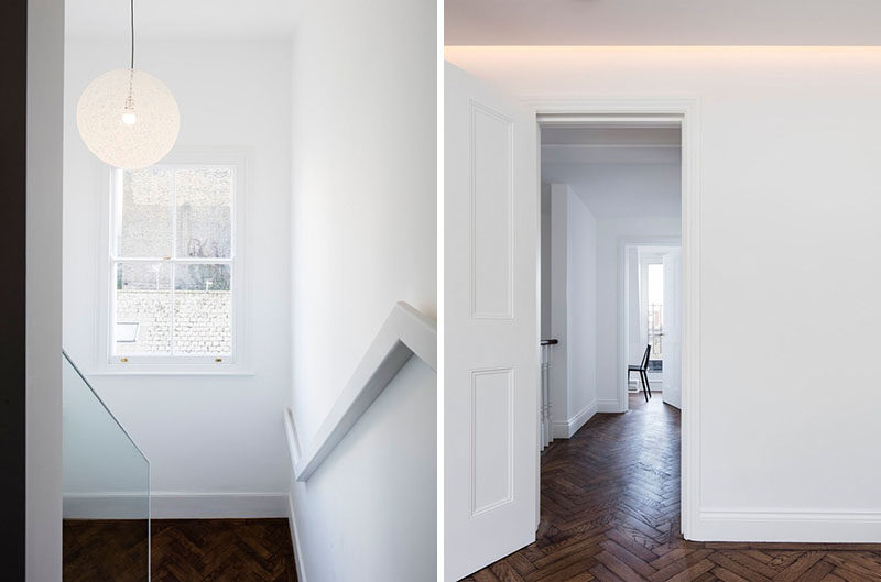 White and wood stairs lead up to the master bedroom and a home office. Hidden lighting helps to create a soft glow on the ceiling. #Stairs #Lighting #WoodFlooring