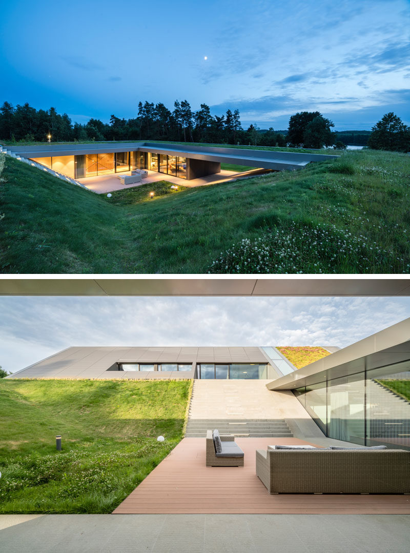 Architecture Ideas - This modern has been built into the hillside, integrating with the surrounding landscape, and creating a closeness to nature. #ArchitectureIdeas #GreenRoof #ModernHouse #ModernArchitecture #GlassWalls