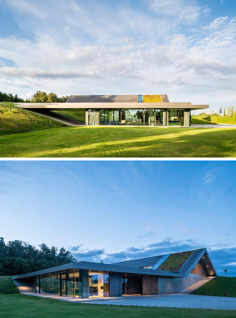 Architecture Ideas - This modern has been built into the hillside, integrating with the surrounding landscape, and creating a closeness to nature. #ArchitectureIdeas #GreenRoof #ModernHouse #ModernArchitecture #GlassWalls